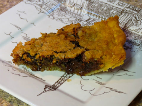 A slice of chocolate bourbon pecan pie